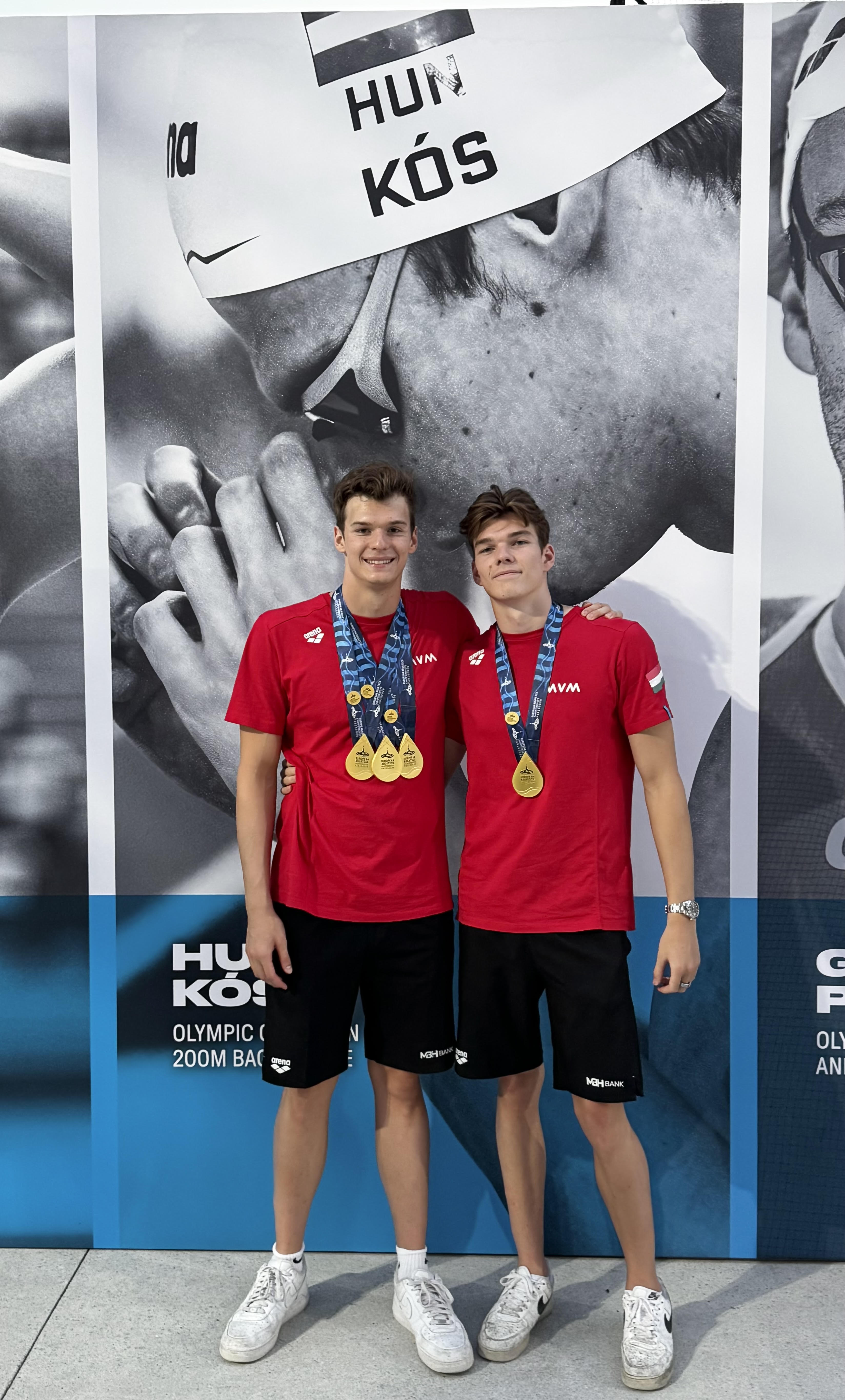Hubert Kos and Oliver Kos with medals after swimming win